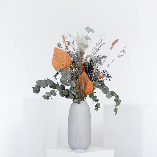 Rustic beauty: dried flower arrangement with eucalyptus and accentuated highlights